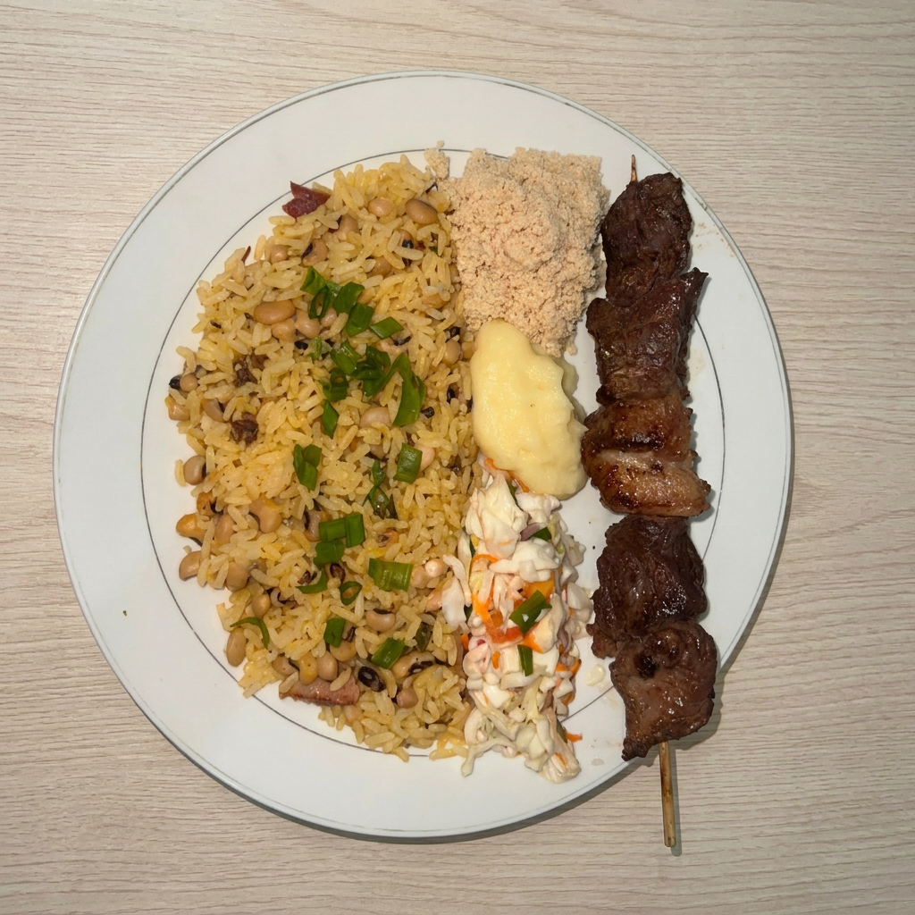 Espeto de carne, baião, purê de batata, farofa e vinagrete