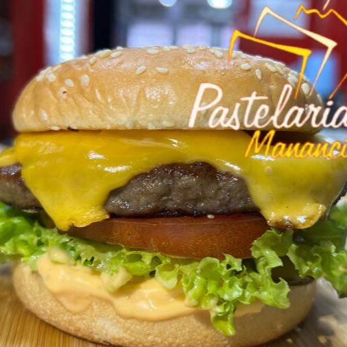 Pão com gergelim, 1 Hambúrguer de picanha 120g, Queijo, Alface, Picles, Cebola, Tomate e o viciante molho Billy Jack Original.