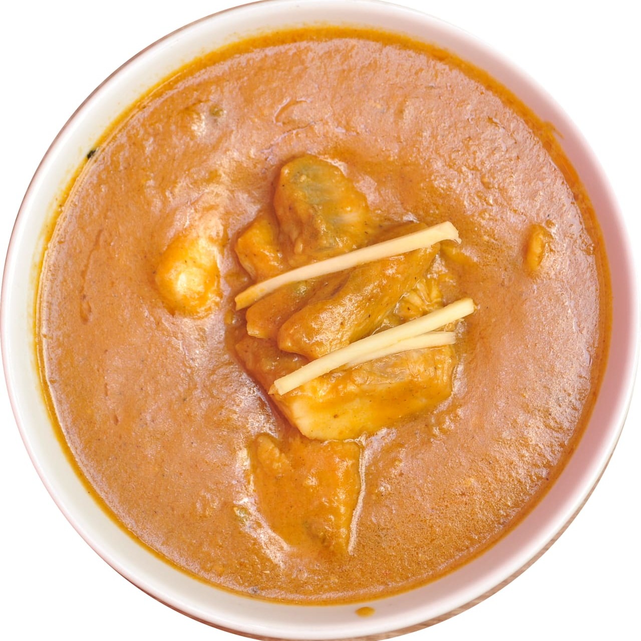 Peixe cozido em molho curry e leite de coco.