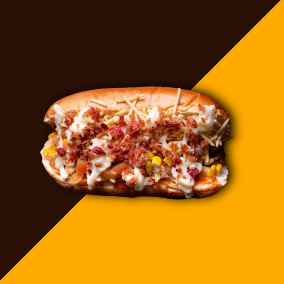 1 Cachorro (Pão, 2 Salsicha ou 2 Linguiça, Milho, Ervilha, Azeitona, Tomate, Cebola, Presunto, Cheddar, Catupiry, Passas, Ketchup, maionese de alho e Batata Palha