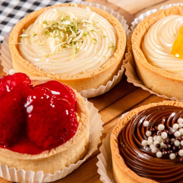 Descubra a delícia das nossas Tarteletes! Com uma massa fininha e crocante, cada tartelete é preenchida com um recheio irresistível.  Imagem Ilustrativa