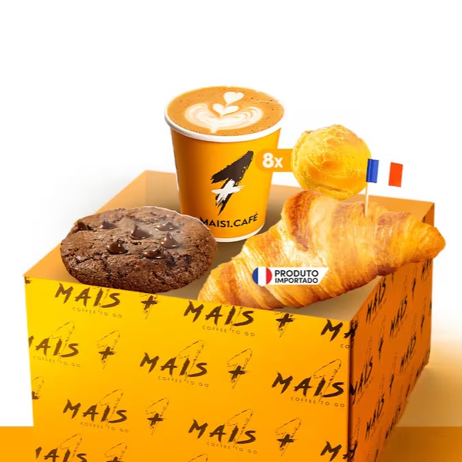 A 'Cesta nº 1' é uma seleção especial da categoria 'Cestas'. Ela é composta por uma caixa personalizada da Mais1 Café, de dimensões 20x13x12, que abriga uma rica seleção de produtos. Saboreie o autêntico Cappuccino italiano, uma bebida cremosa e aconchegante, perfeita para começar o Dia. Acompanha uma porção de mini pães de queijo, fresquinhos e saborosos. Não poderia faltar o clássico Croissant M, de textura amanteigada e macia, e um irresistível Cookie de chocolate, com pedaços generosos do mais puro cacau. Uma cesta feita para os amantes de um bom café da manhã ou lanche da tarde!