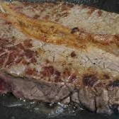 Contra file grelhado com arroz , tutu e couve