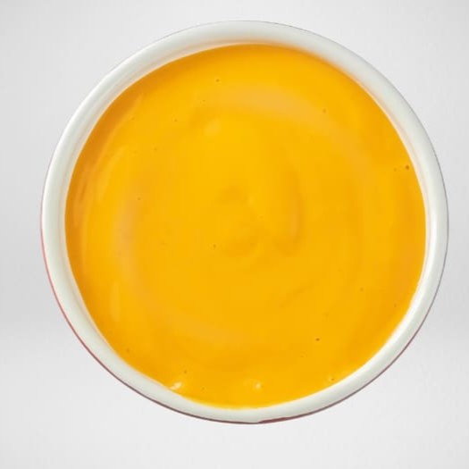 Molho cheddar cremoso e intenso, com sabor marcante e textura aveludada. O acompanhamento ideal para quem ama queijo.