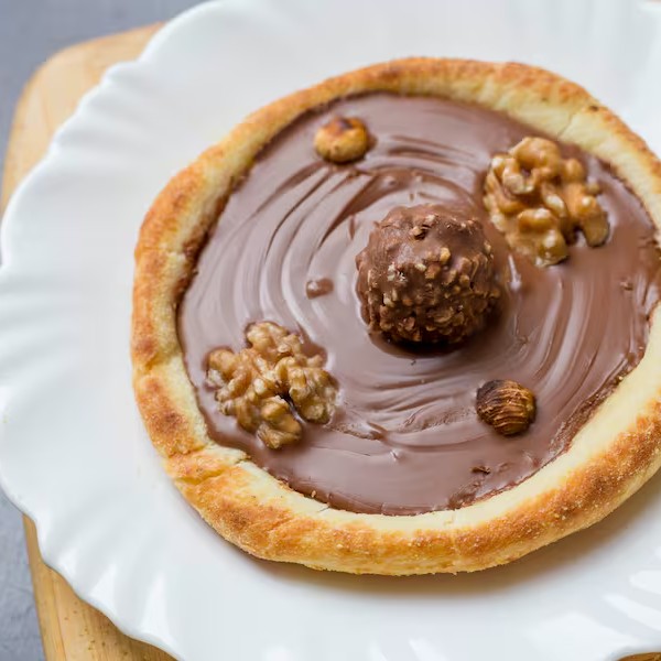 Chocolate ao leite e bombom Ferrero.