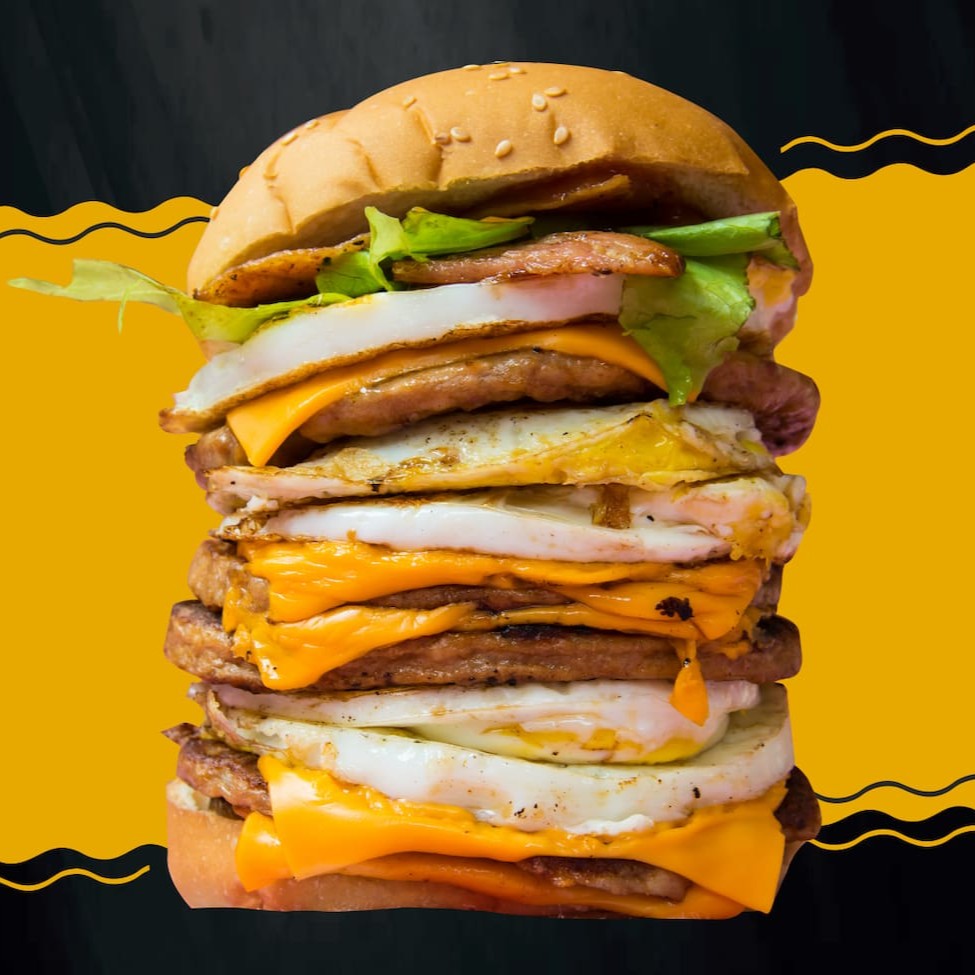 Pão com gergelim, 5 carnes, 5 ovos, queijo cheddar, bacon, salada, maioneses temperada, barbecue, katchup, mostarda.