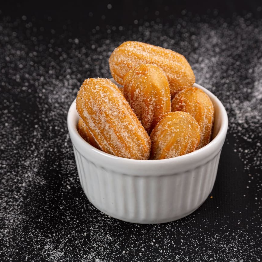 O delicioso churros do chef com recheio de doce de leite ou chocolate.