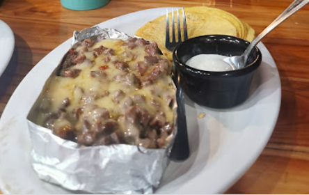 1 Papa Rellena de Pastor + Agua del Dia (1 litro)