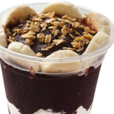 Condimentos dentro do copo de açaí