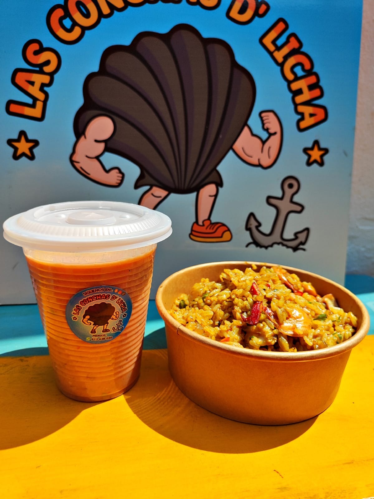Leche de Tigre más Arroz con Mariscos más Bebida