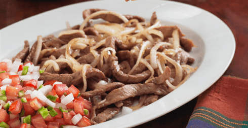 Bisteces Encebollados