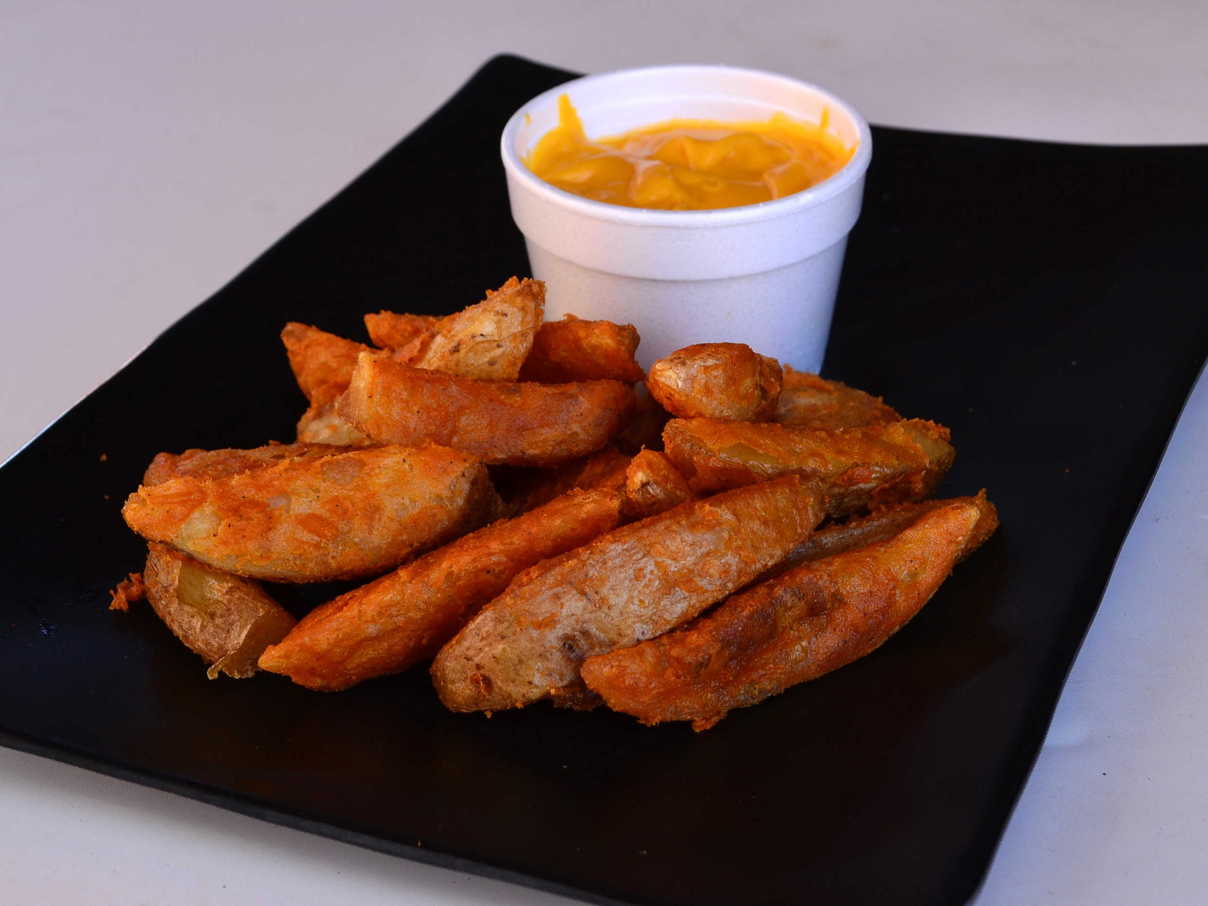 Papas Sazonadas con queso