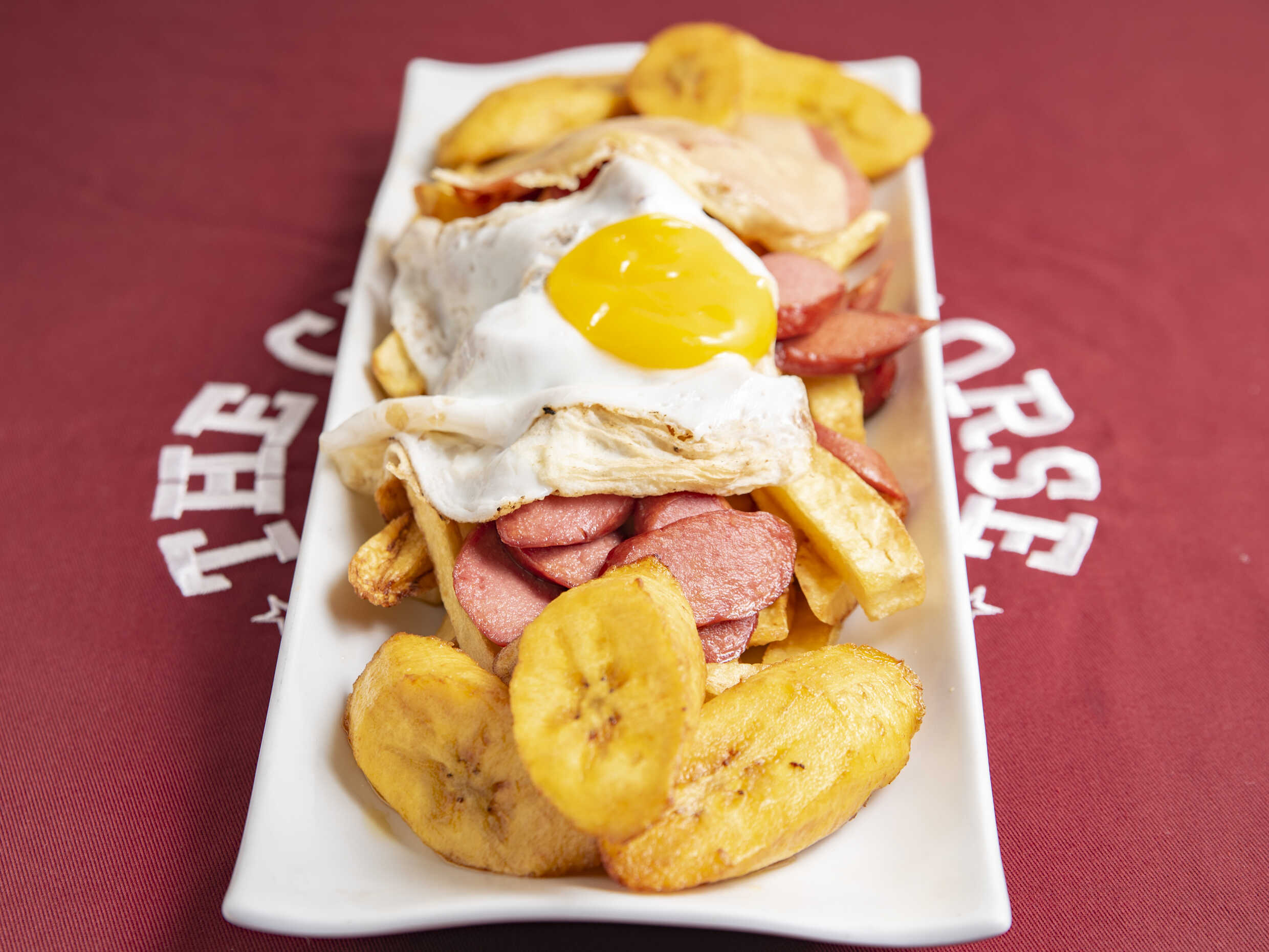 salchipapa de la casa + Coca Cola