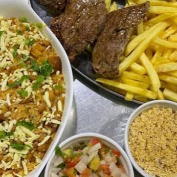 Acompanha: Churrasco na Brasa, Farofa, Vinagrete e Batata Frita