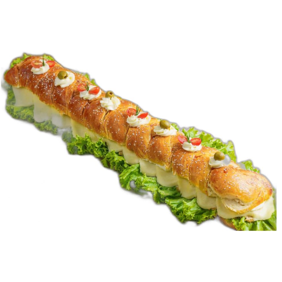 Descubra o nosso saboroso 'Pão a Metro Recheado', uma verdadeira joia da categoria 'Sanduíches'. Este prato apresenta um pão fresco e crocante recheado generosamente, proporcionando uma explosão de sabores a cada mordida. A textura macia do pão combina perfeitamente com o recheio abundante, criando uma experiência culinária única e inesquecível. Perfeito para quem adora um sanduíche de qualidade e sabor incomparável. Não espere mais, venha experimentar o nosso delicioso 'Pão a Metro Recheado'!