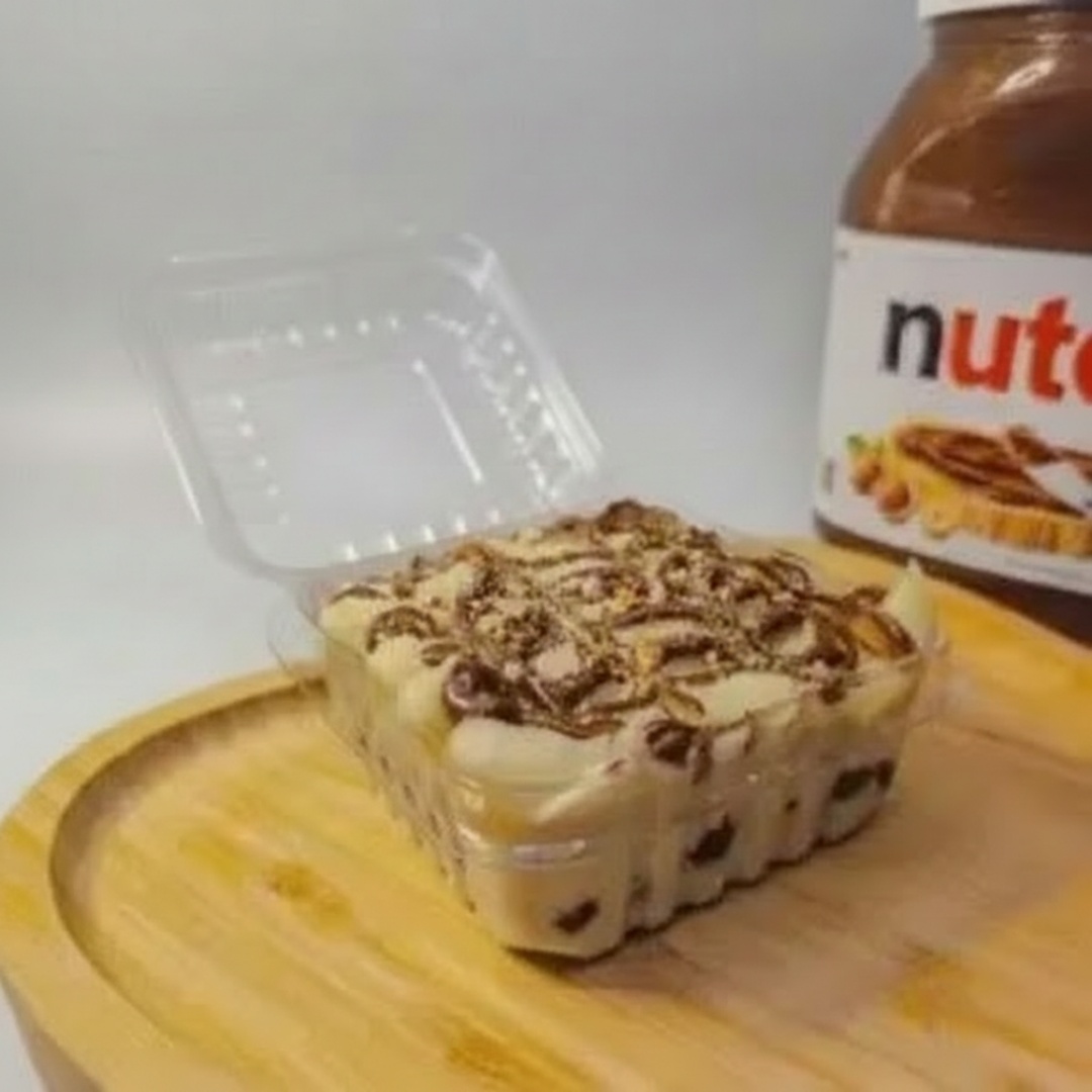Pavê harmoniza a suavidade do creme branco com a intensidade da Nutella. Cada colherada revela camadas de pura perfeição. (Aprox. 110g)