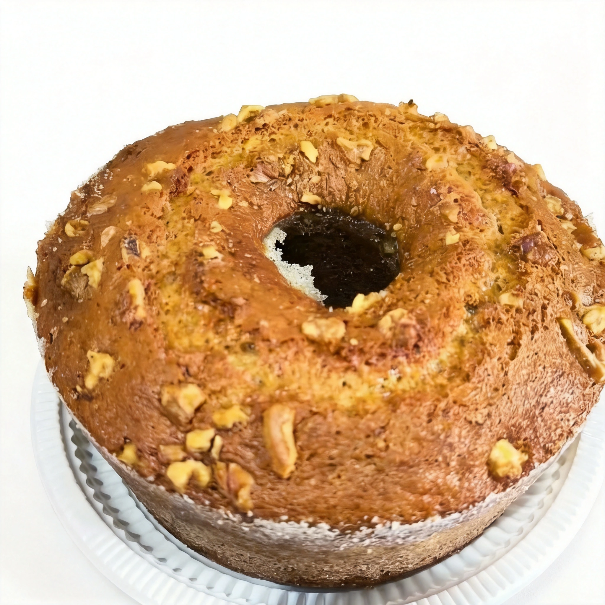 Apresentamos o nosso Bolo de Nozes, uma preciosidade da categoria 'Bolos Artesanais 2'. Sua massa, rica em nozes, é indescritivelmente macia, resultando em uma experiência culinária de alta qualidade. O sabor é absolutamente inesquecível, criando uma conexão única e deliciosa com cada mordida. É a opção perfeita para um acolhedor cafezinho da tarde, trazendo aconchego e prazer a seu momento de pausa. Garantimos, não há bolo de nozes de tamanha qualidade em nenhum outro lugar de Santa Cruz. Experimente e se surpreenda!