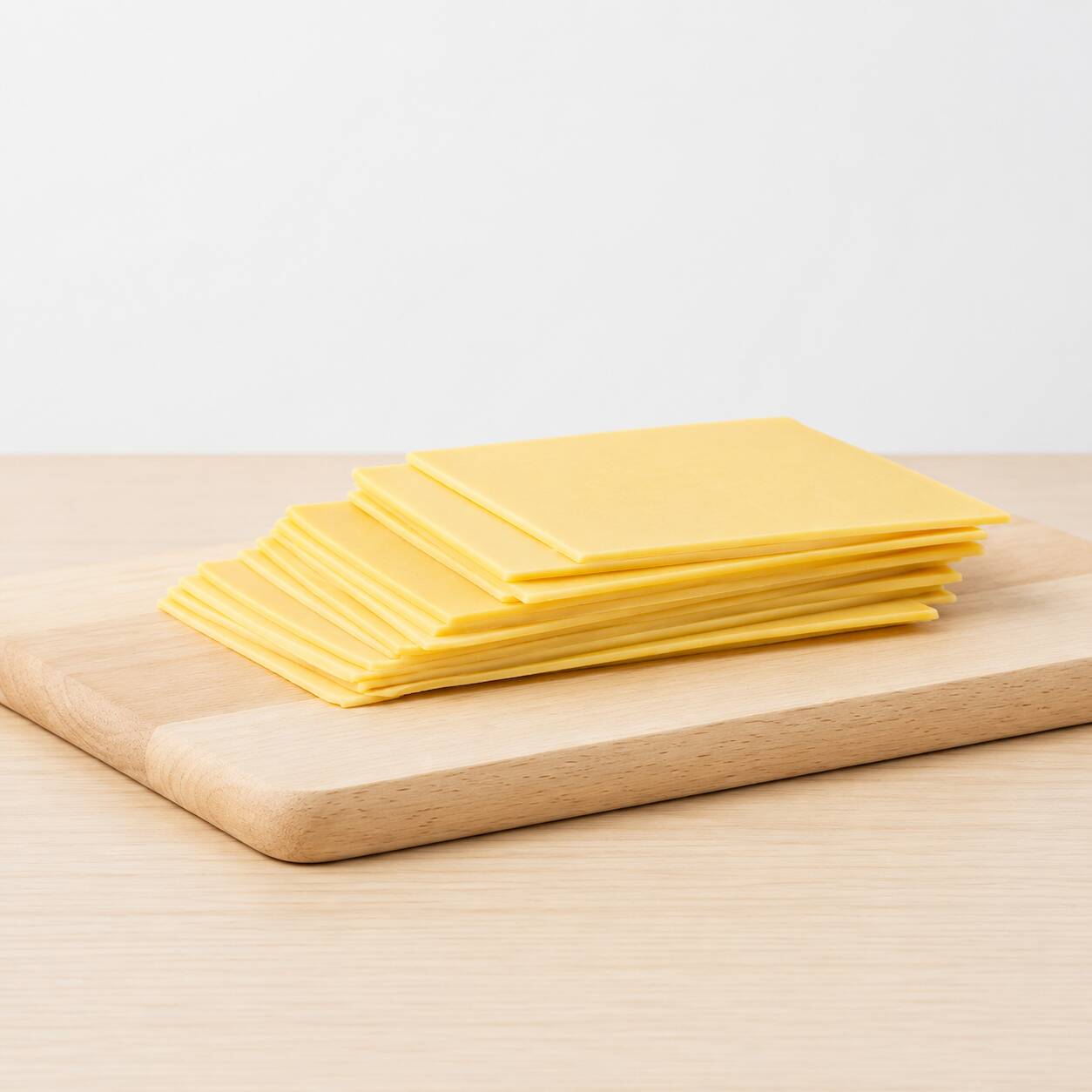 5 fatias de queijo mussarela, em torno de 100-150g