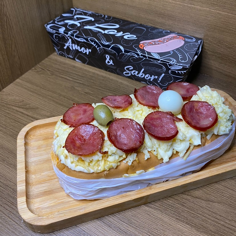 Acompanha: Pão, Salsicha ou Linguiça, Molho da Casa, Milho, Ervilha, Molho da Casa, Batata Palha, Queijo Mussarela, Cheddar ou Catupiry, Calabresa e Ovo de Codorna.