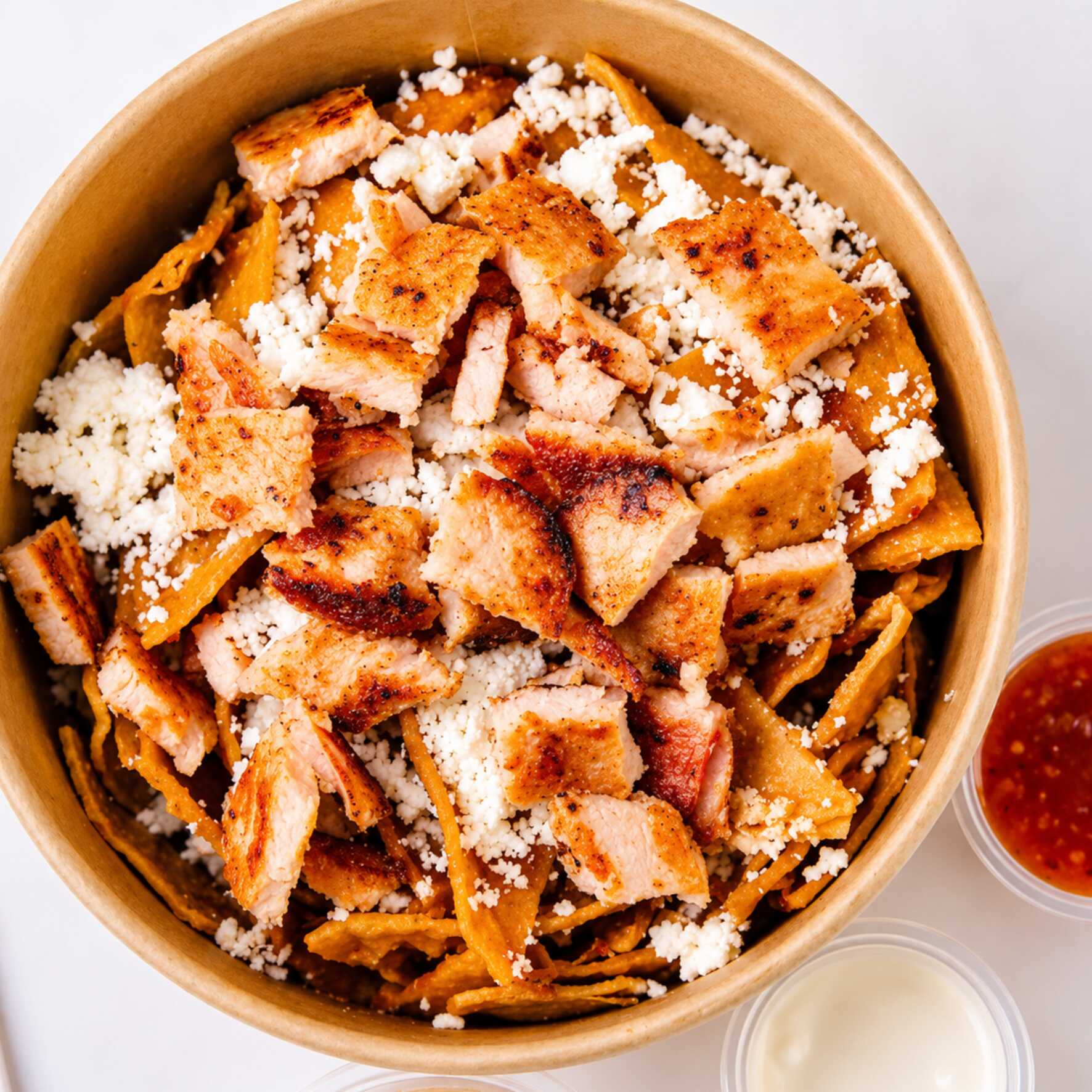 Chilaquiles Rojos de Chuleta de Pavo Asada