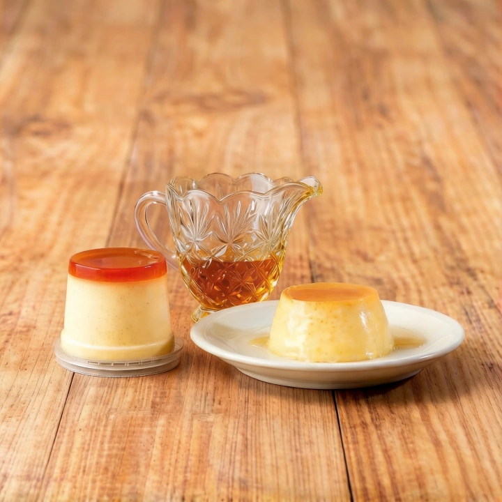 Este é um pudim de leite condensado excepcionalmente cremoso e suave, criado com paixão para os verdadeiros amantes de pudim. Uma experiência culinária que derrete na boca, o seu sabor é realçado por um caramelo perfeitamente preparado, proporcionando a combinação mais sublime. Peso aproximado: 150g