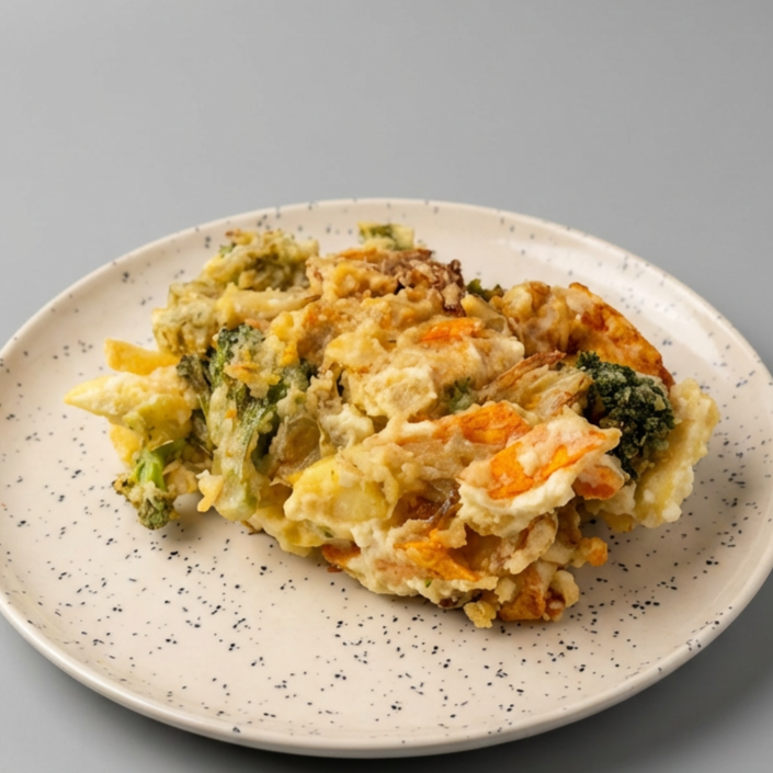 Empanado de legumes, batata em tiras, cenoura, brócolis, pimentão e cebola