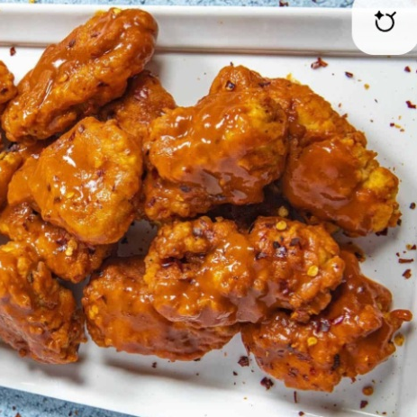 BONELESS DE POLLO BAÑADOS EN SALSA