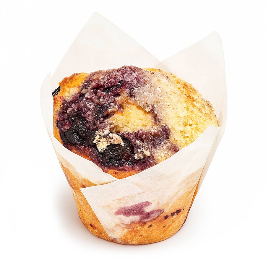 Muffin com mirtilos inteiros e cobertura de crumble de limão. Aprox. 100g. Contém glúten e lactose.