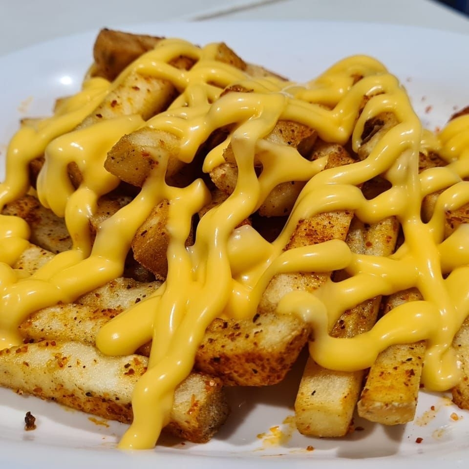 Papas cajún con queso
