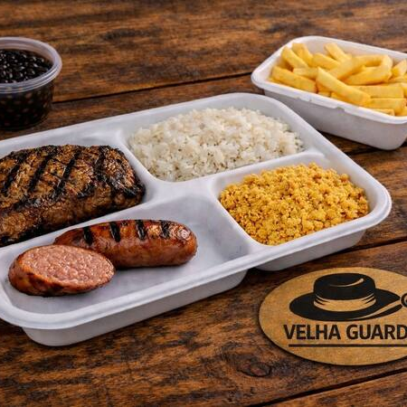 Suculento ancho grelhado com arroz, feijão, farofa, fritas e linguiça toscana.