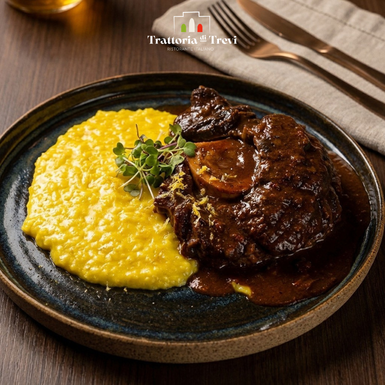 Tradicional risoto de açafrão preparado com arroz carnaroli, acompanhado de ossobuco bovino braseado lentamente em redução de vinho tinto e ervas aromáticas.