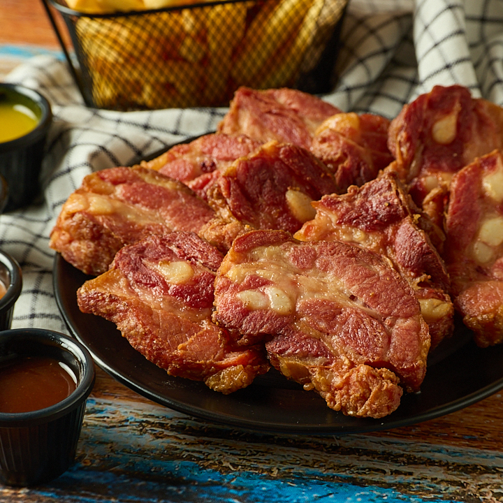 10 Costillas + Papas + Dip de Queso