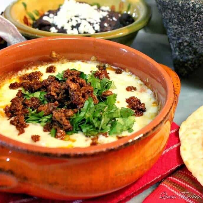 Queso fundido con Carne a elegir