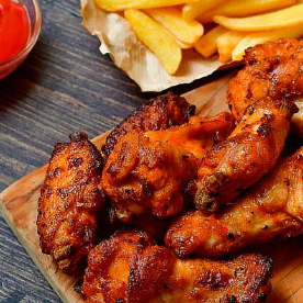 Alitas 1/2 kg con Papas