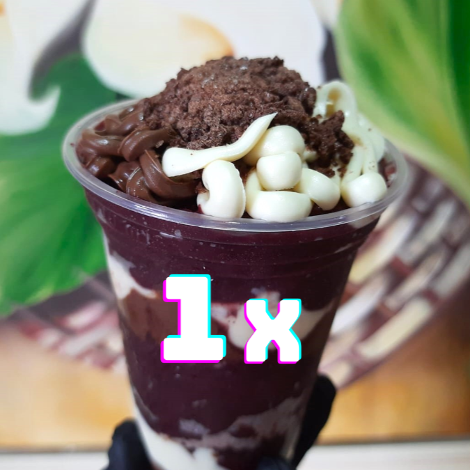 Monte e aproveite o nosso Açaí Trufado Ovomaltine Supreme, disponível nos tamanhos 330ml, 440ml, 550ml, 770ml ou 1000ml! Feito com Açaí Cremoso, camadas generosas de Creme de Ninho, Ovomaltine crocante e Creme de Avelã, distribuídos em todas as camadas, de forma bem caprichada. Uma verdadeira sobremesa trufada premium, intensa, equilibrada e não necessita adicionais.