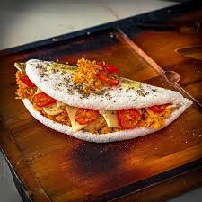 Tapioca Tudão: Mussarela, Frango, Carne Seca, Bacon, Tomate, Orégano, Cheddar, Azeitona, Calabresa, e Catupiry