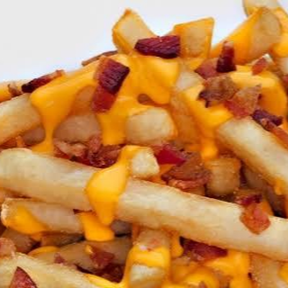 Batata frita com requeijão cremoso sabor cheddar