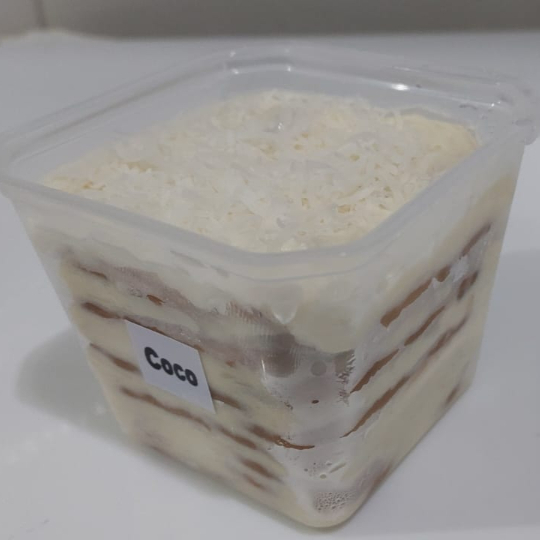 Pavê em Camadas intercaladas de Biscoito com Recheio e Cobertura de Creme de Coco Cremoso. ###Tags### bolo no pote bolo vulcao cenoura Ninho chocolate bombom aberto copos da felicidade morango uva coxinha de morango chocolate Ninho Oreo chocolate ao leite leite condensado coco beijinho brigadeiro gourmet tradicional moranguinho churros Nutella 2 amores meio amargo coco queimado presente na caixa promoção cupon cupom oferta desconto como taxa gratis entrega rapida Nutella brownie braunie brawni Ninho doce chocolate brigadeiro docinho donuts docino sobremesa bolo de pote copo da felicidade caseiro banoffee morango Ouro Branco galak Sonho de Valsa choquito ferreiro rocher trufa bombom uva kitkat Kit Kat Kinder bueno charge amendoim Confete Dia dos pais natal Dia das maes Dia das mães namorados promoção promocao oferta desconto barato doce sobremesa chocolate entrega rapida grátis grátis morango fresco docinho brigadeiro leite condensado coxinha e morango Pave Pavê Pave de Pote Pavê