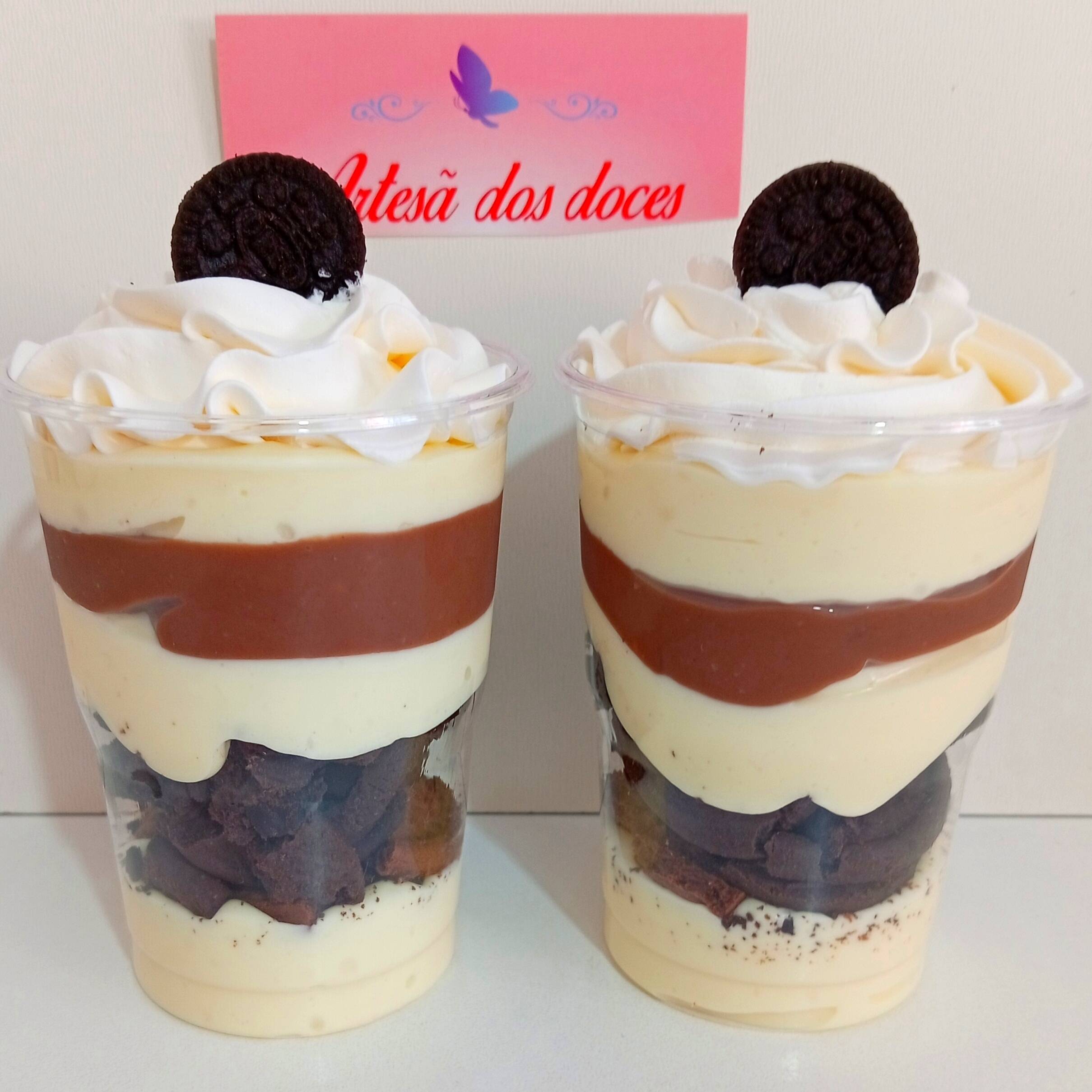 copo da felicidade uma explosão de sabores, creme de ninho, bolachas de chocolate meio amarga, brigadeiro cremoso de chocolate, finalizado com chantilly e mini oreo