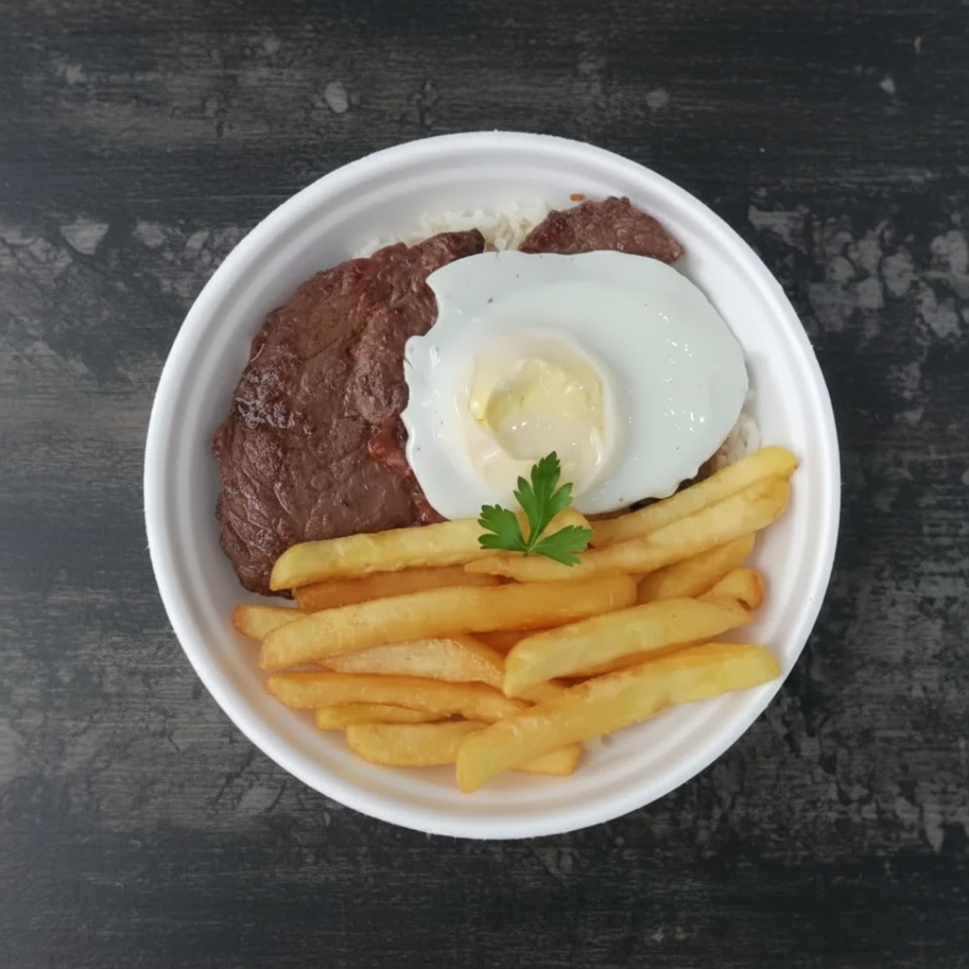 Delicioso bife de boi passado na hora acompanhado de ovo frito,arroz soltinho, feijao bem temperado, fritas crocante e salada. Um prato irresistível e suculento.