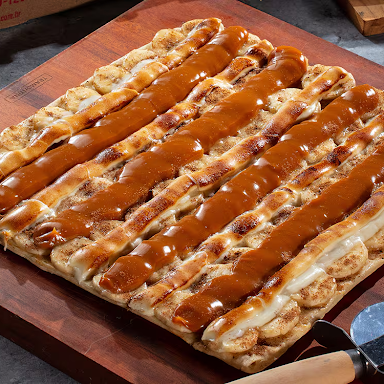 Escolha o sabor que mais combina com você entre nossas opções disponíveis de Pizza Média (25cm X 25cm). Preparada na hora com massa artesanal e ingredientes de primeira. Aproveite!