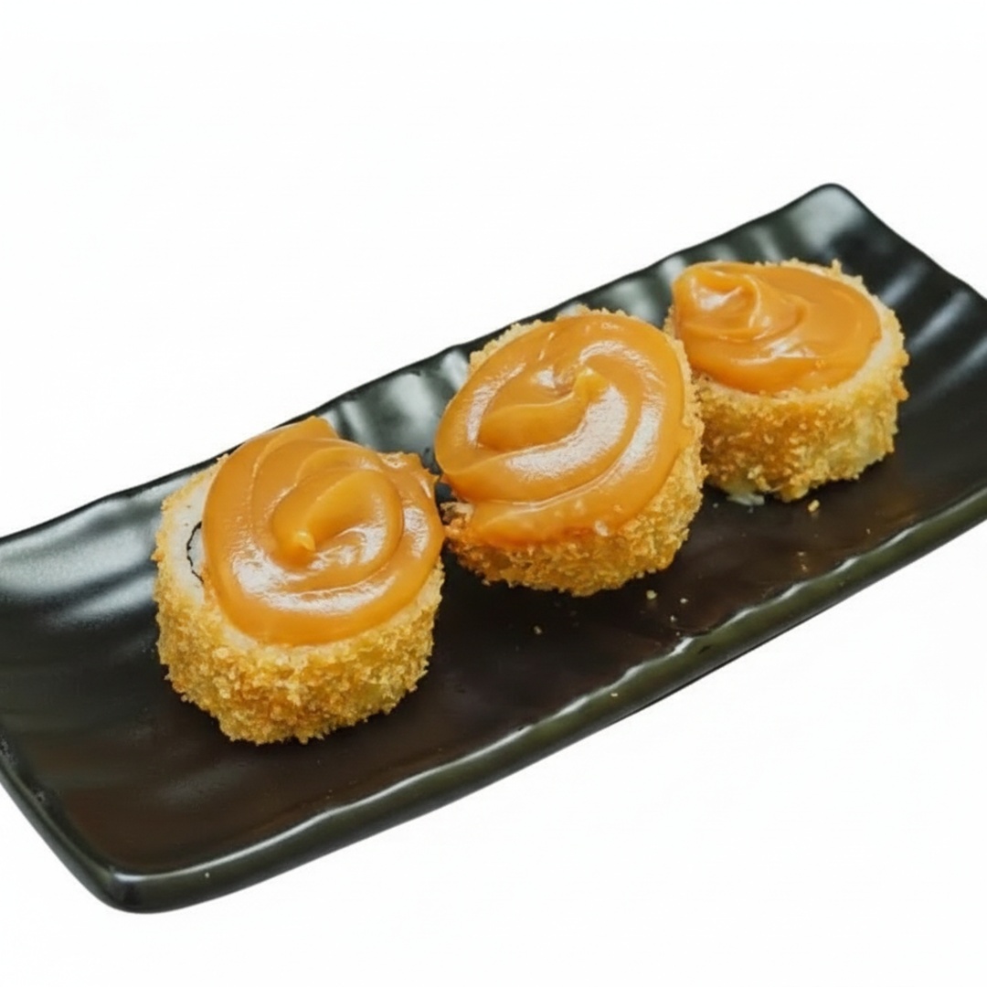 Banana empanada na panko e frita e finalizada com doce de leite.