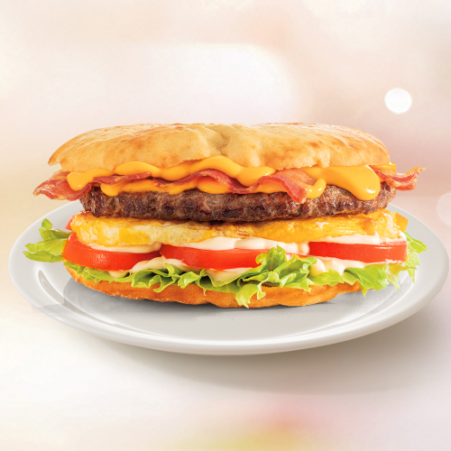 Beirutão de 500 g, pão sírio, um hambúrguer de 180 g, bacon, ovo frito, alface americana, tomate, maionese e um Delicioso Molho Cheddar Cremoso.