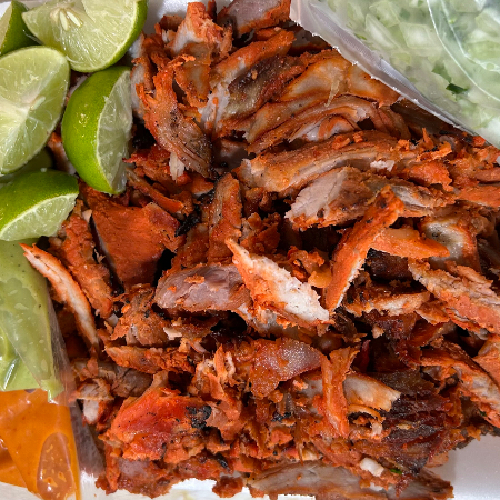 1/2 kilo de carne al pastor con 2 sodas de latas
