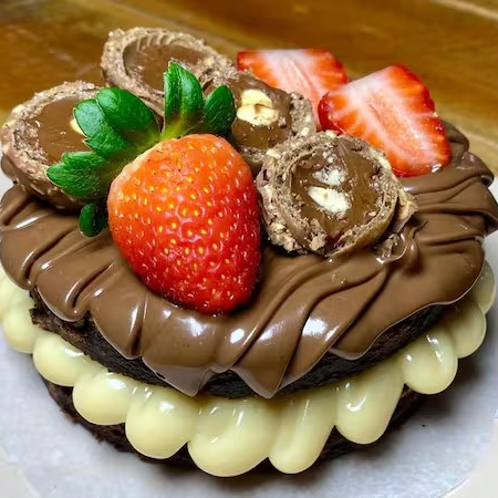 Crema de Ninho com Pedaços de Brownie envolto no delicioso Brigadeiro e Ninho Cremoso da casa.