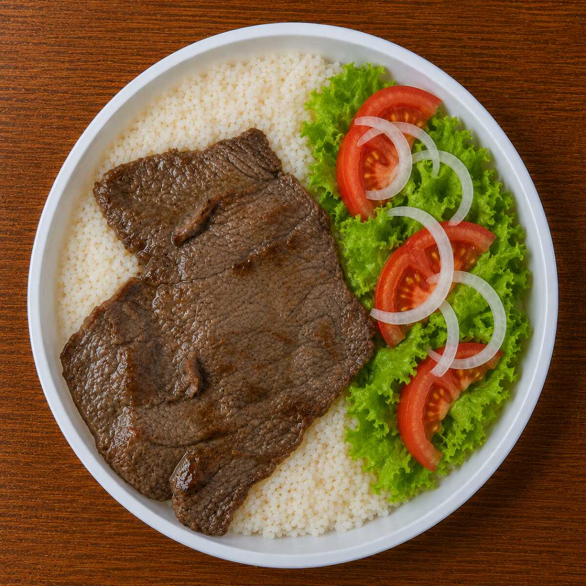 Bife grelhado bovino com arroz, feijão e salada (Aprox. 450g).