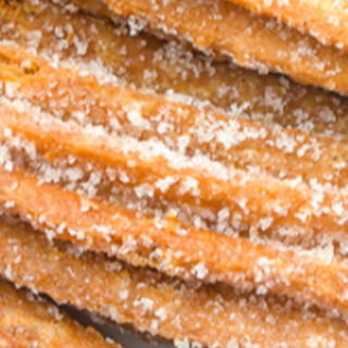 Churro Mex azucarado relleno de dulce de leche