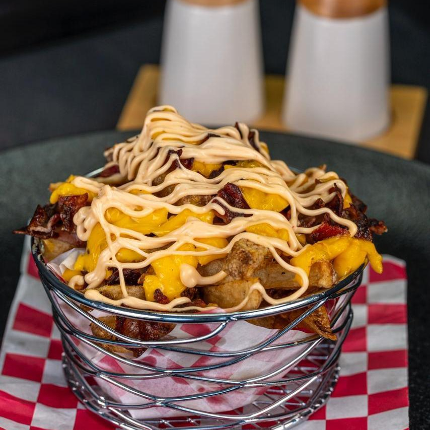PAPAS TOCINETA Y QUESO CHEDDAR