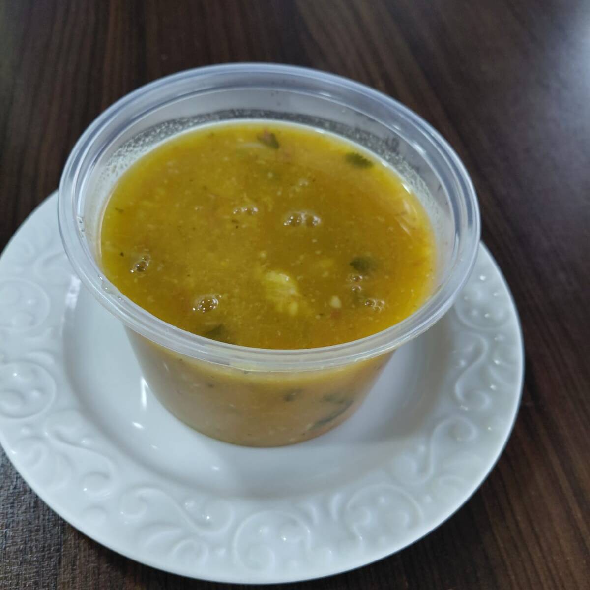 Mocotó , bacon, calabresa , temperos naturais . Acompanhamento 1 pão francês