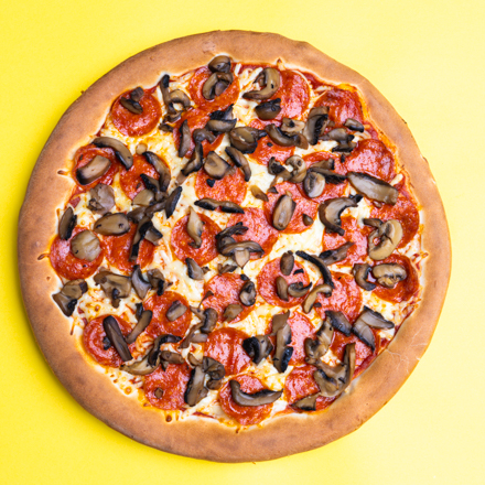 Pizza de Pepperoni y Champiñón.